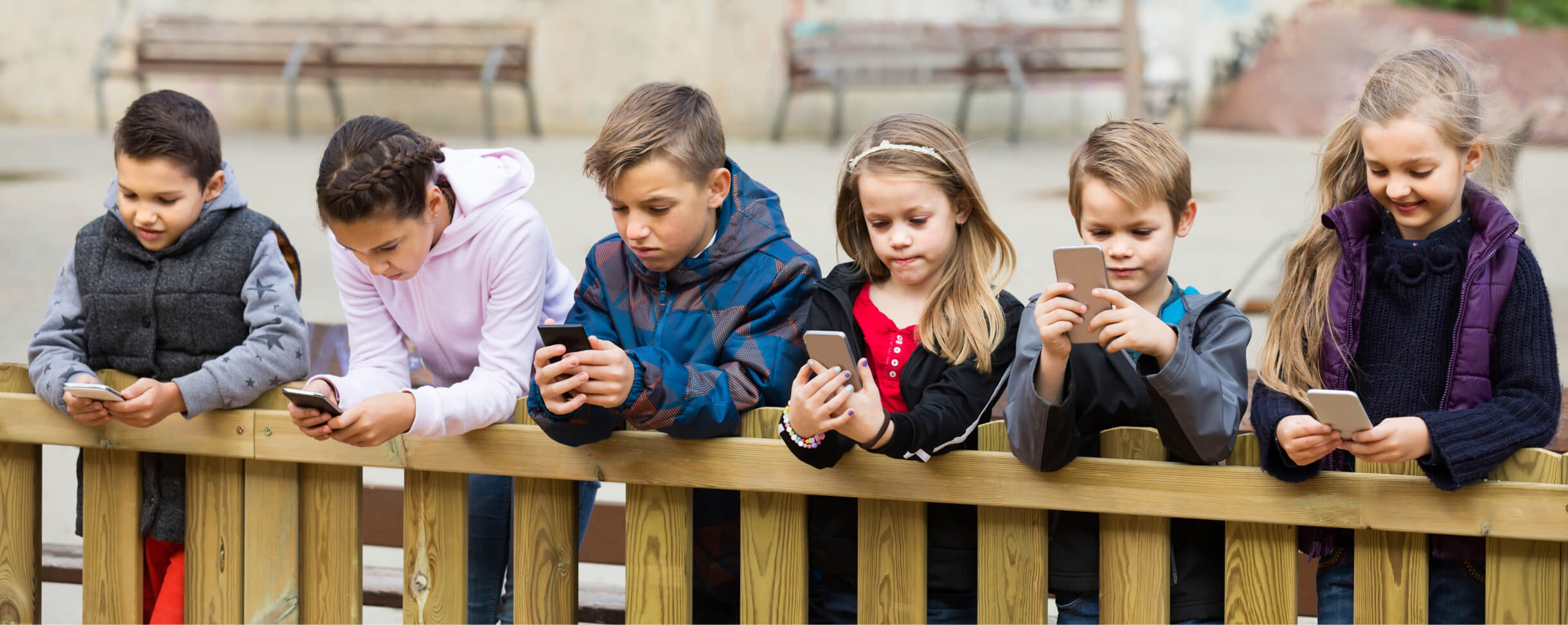 children holding phone